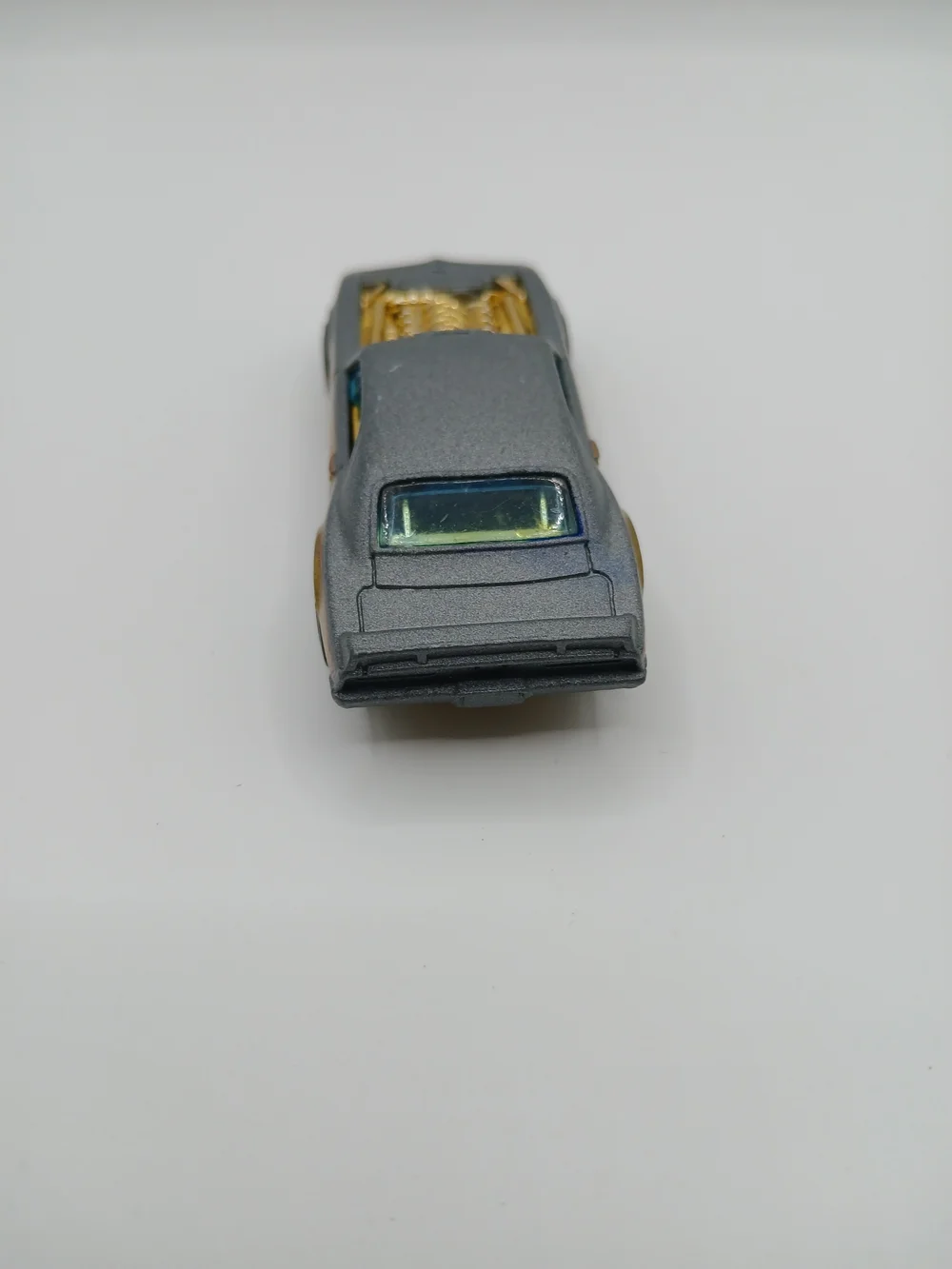 Gray Toy Muscle Car with Gold Engine Detail
